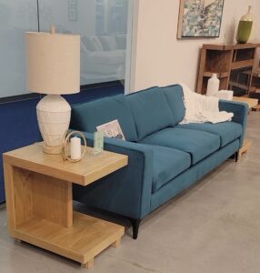 Jade green sofa and oak side table