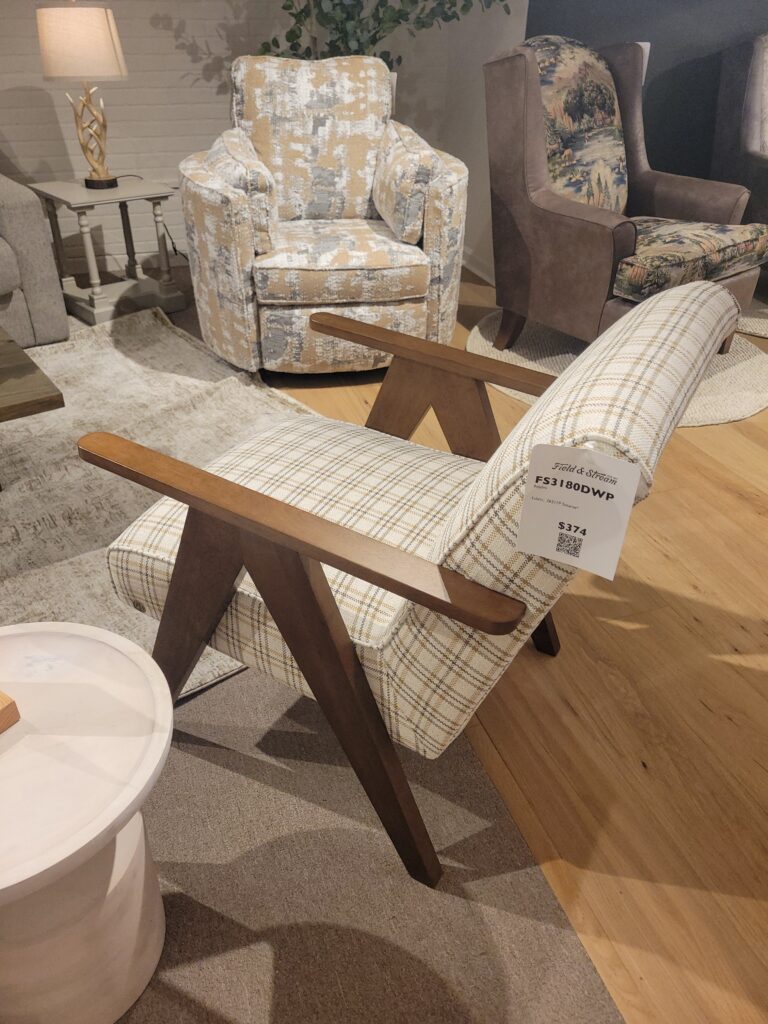 Plaid chair with wooden frame in a furniture showroom