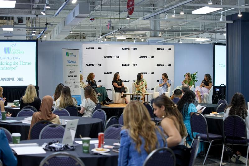 Panelist of women in front of an audience