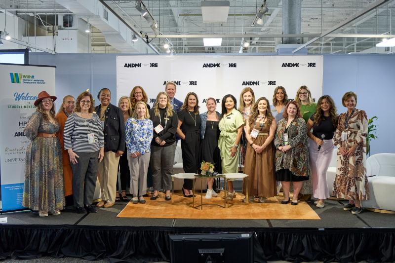 Group of women posing on a stage