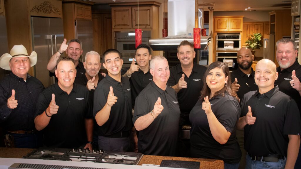 group of retail team members holding up one finger